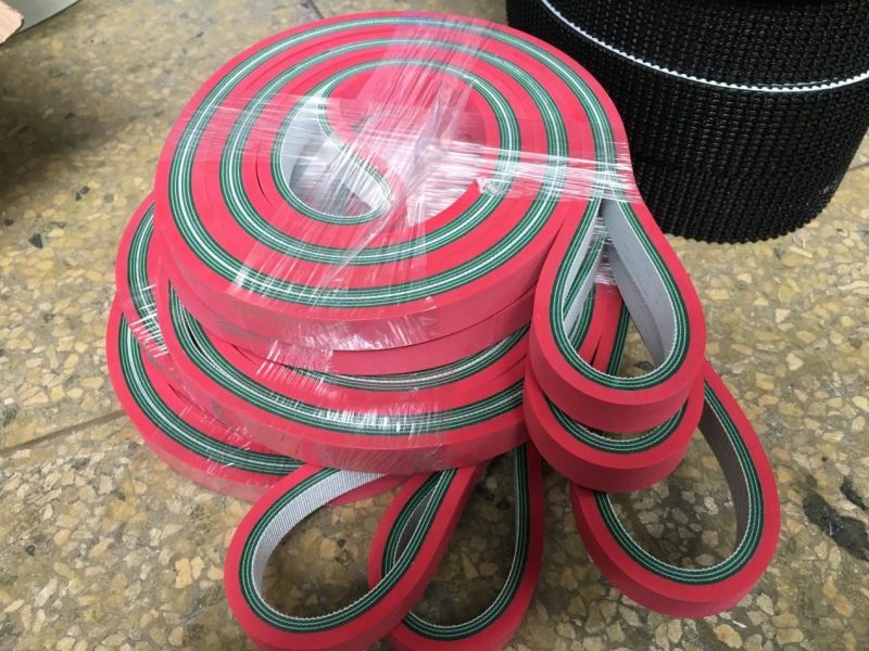 Green PVC conveyor belt with red rubber surface